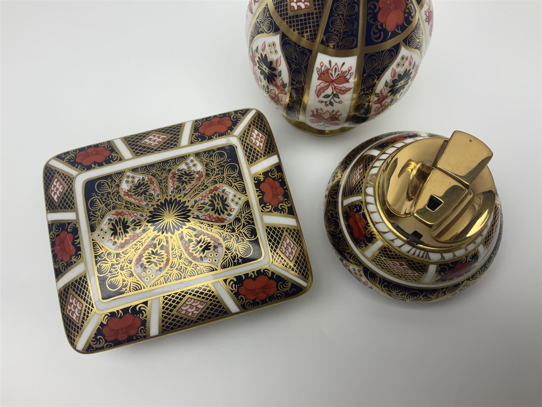 Royal Crown Derby Old Imari pattern vase, together with matching lighter and trinket box, all with printed marks beneath, vase H18cm