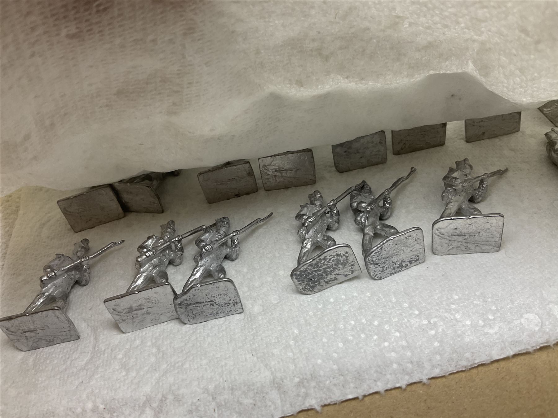 Large variety of predominantly metal miniature soldiers, a mixture of painted and non-painted figures, to include examples of American, British and European soldiers 