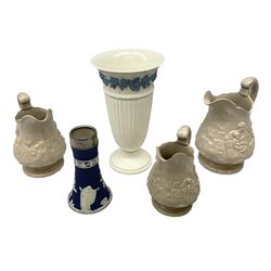 Wedgwood blue jasperware vase of tapering cylindrical form, with silver collar, Sheffield 1915, together with Wedgwood Queen's ware and three victorian graduating jugs with swan handles
