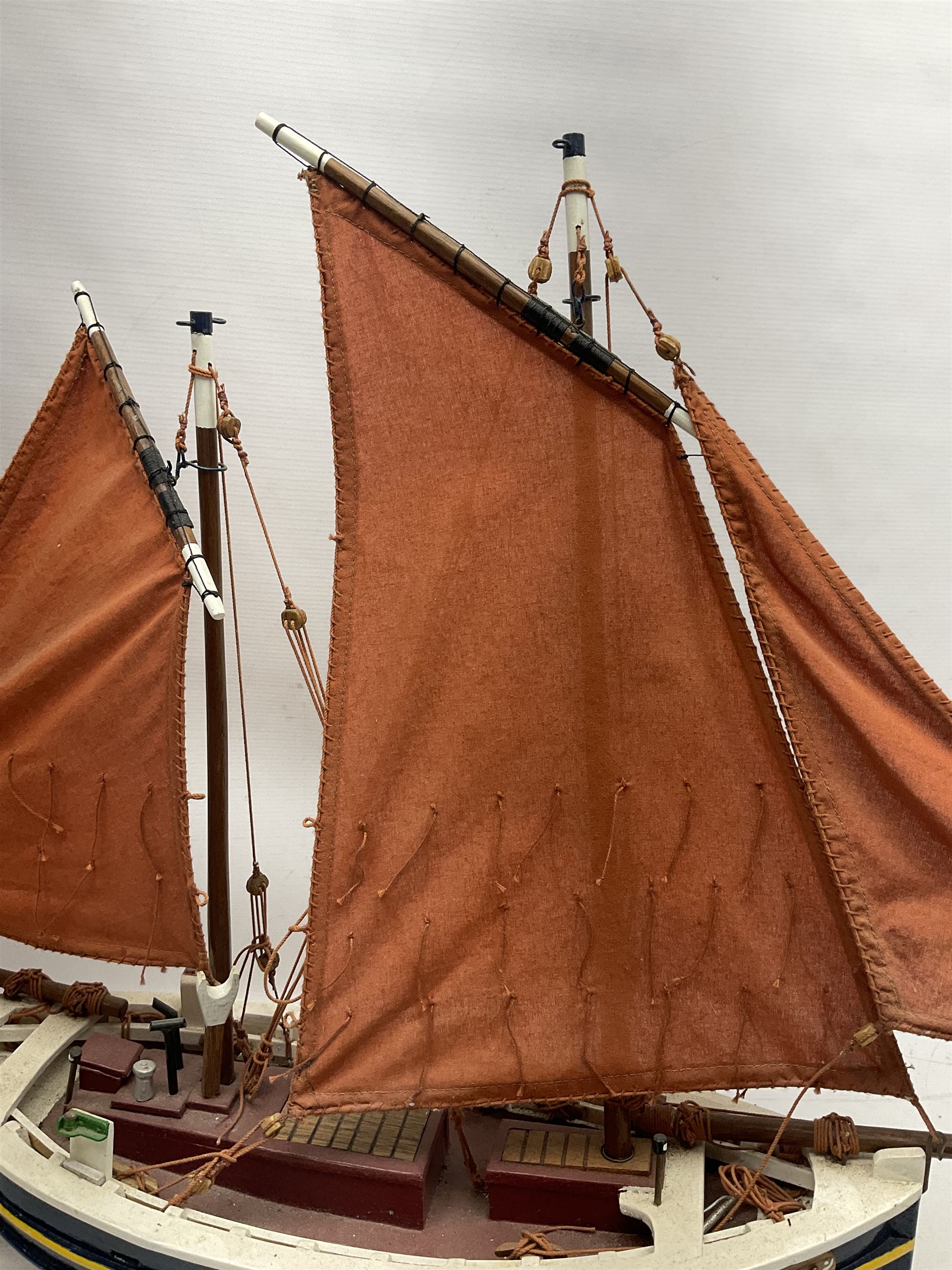 Wooden model of the Peterhead Herring Fishing Boat, Love Divine, PD404. on stand together with Wick Herring Fishing Boat, Galilee WK.1. on stand, L105cm, H64cm