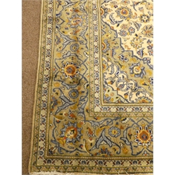  Keshan beige and blue ground rug, central medallion, floral field, repeating border, 290cm x 204cm  