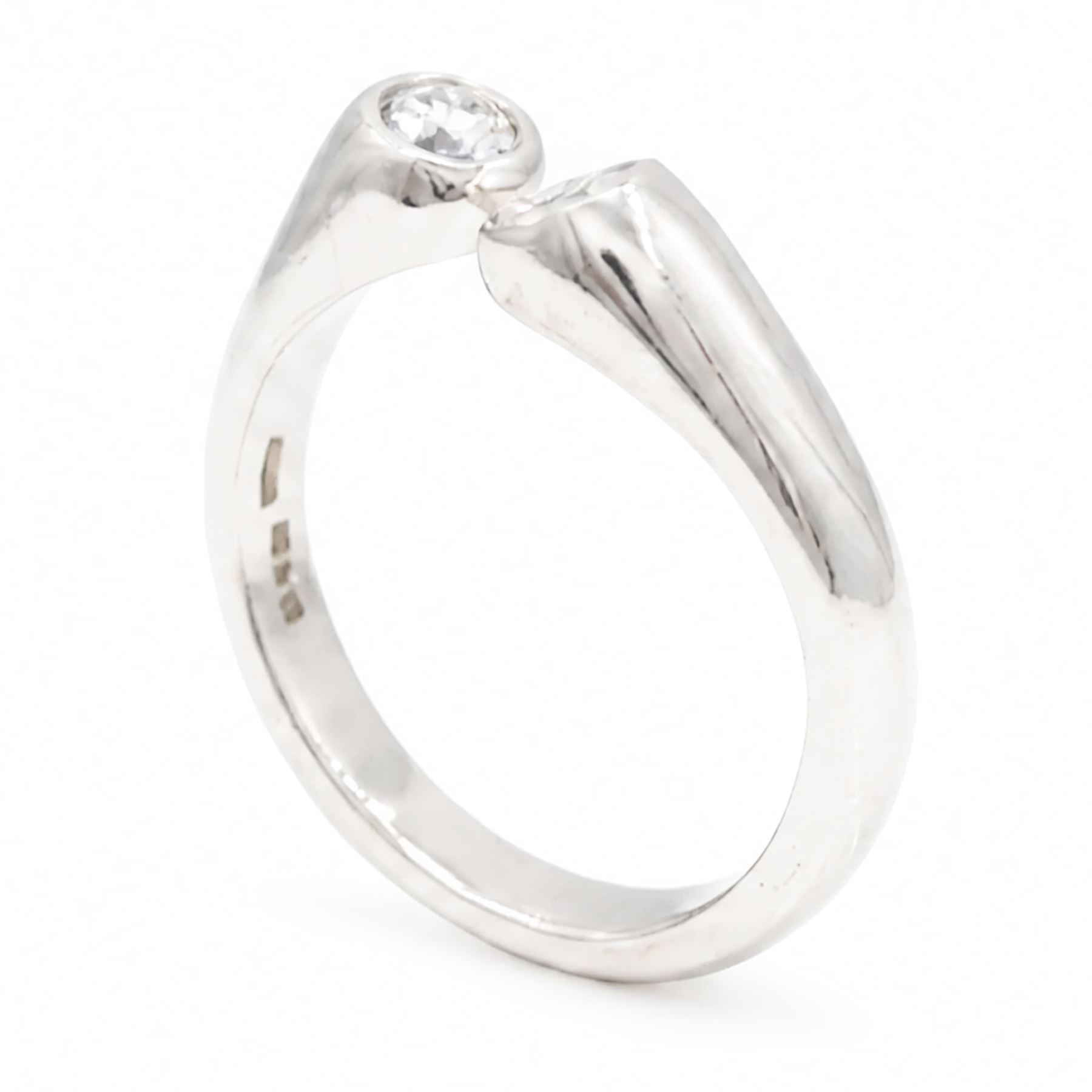 Platinum two stone diamond ring, the two bezel set finials set with a round brilliant cut diamond, Sheffield 1996, total diamond weight approx 0.40 carat