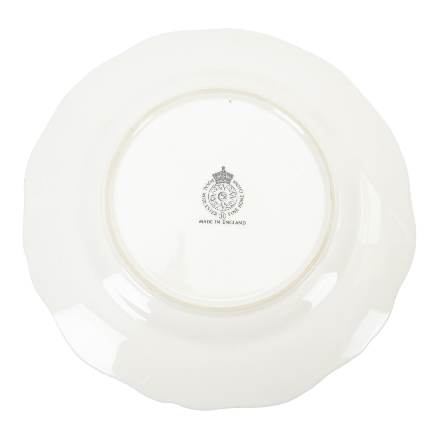 20th century Royal Worcester footed bowl, hand painted with gilt interior, the exterior a still life of fruit upon a mossy ground, signed Freeman, with black printed mark beneath, together with plate side plate and cabinet plate, bowl, H8cm, D13cm