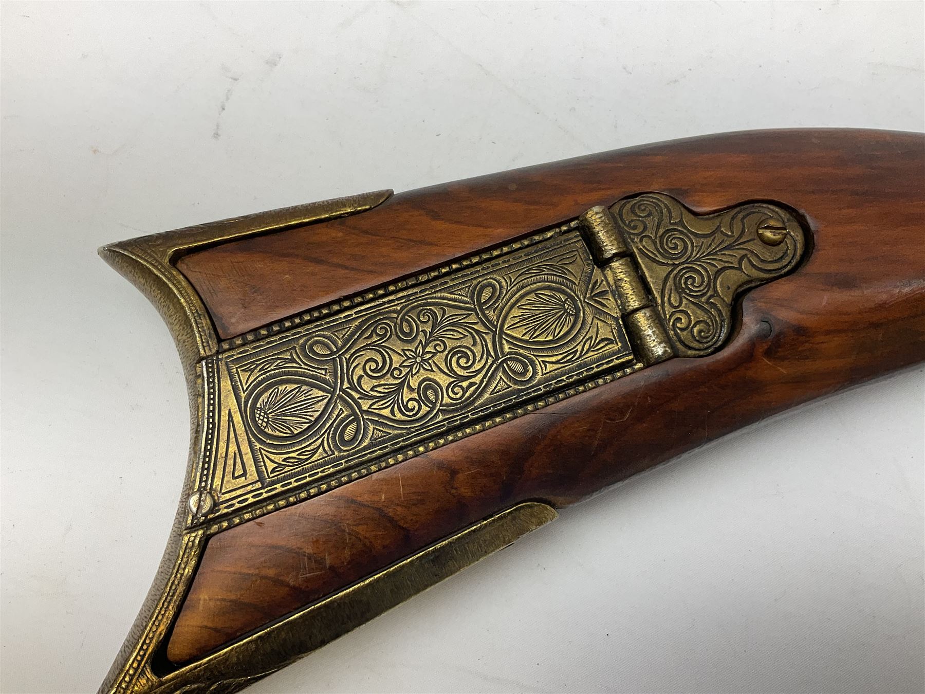 Reproduction non-firing Kentucky style flintlock musket musket, the 87.5cm hexagonal barrel with ramrod under, brass and brassed furniture and patch box to walnut stock L131cm overall