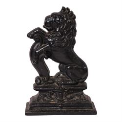 Victorian cast iron doorstop in the form of a rampant lion on a plinth base, together with cast iron Mr Punch doorstop, lion H39cm