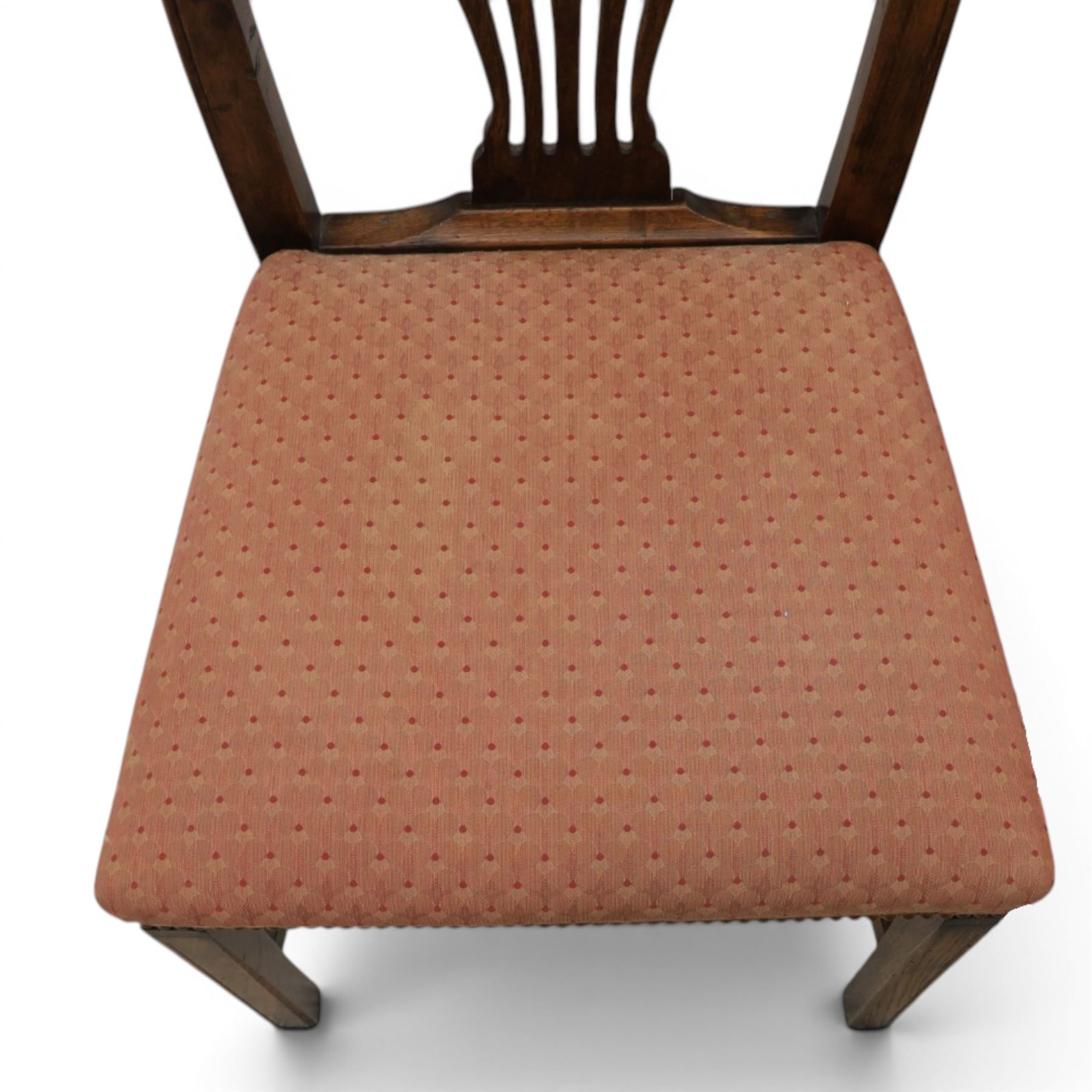 Set of eight George III dining chairs with padded seats, pierced vasiform splat, upholstered seat with brass trim, on square supports with H-stretcher