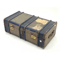 A Vintage travelling trunk with labels to the hinged opening cover, L91cm. 