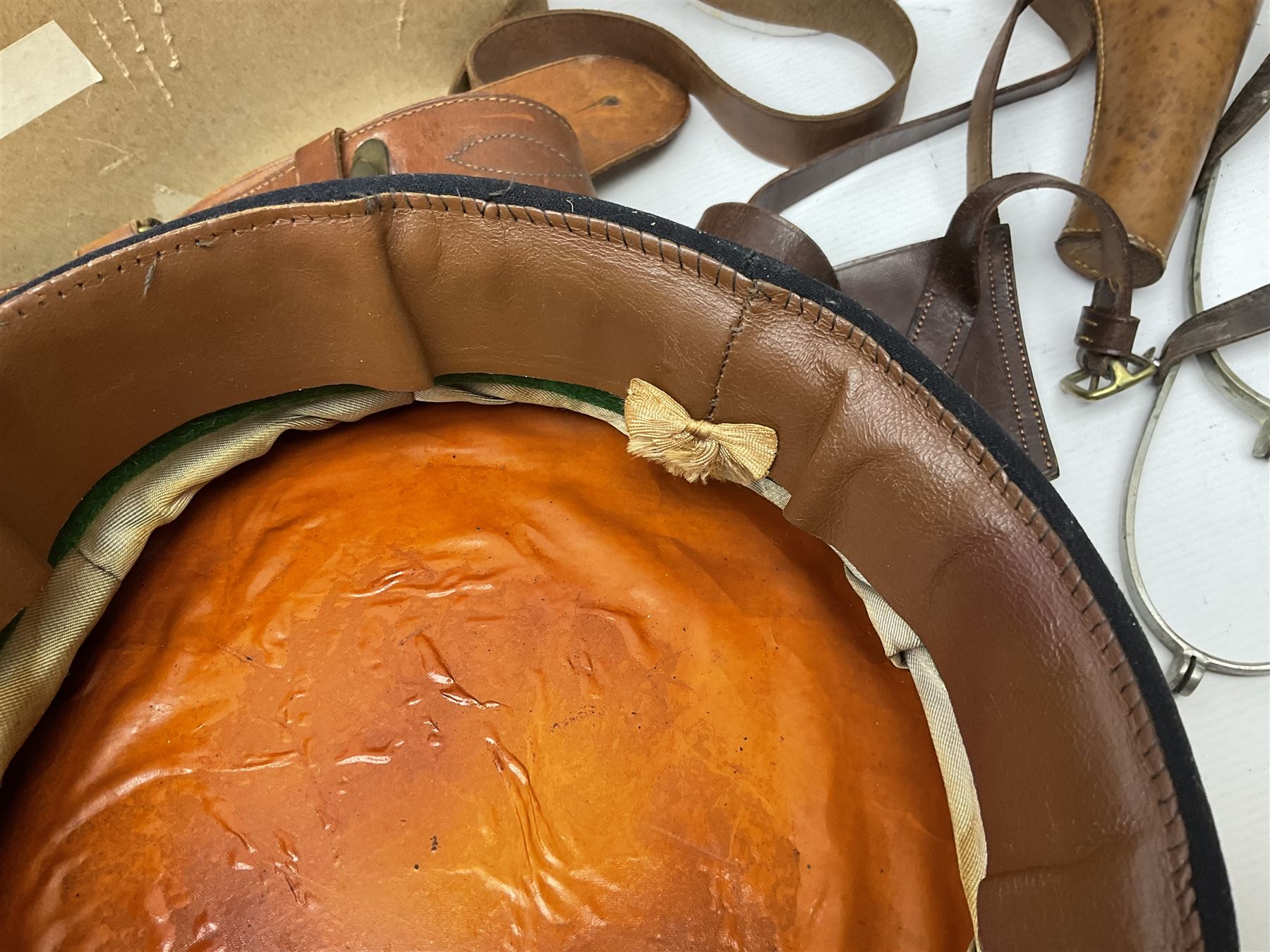 British Army General Staff officer's peaked cap by Herbert Johnson London in Moss Bros. delivery box; two officer's Sam Browne leather belts; leather pistol holster and sword hanger; pair of leather gloves and pair of spurs