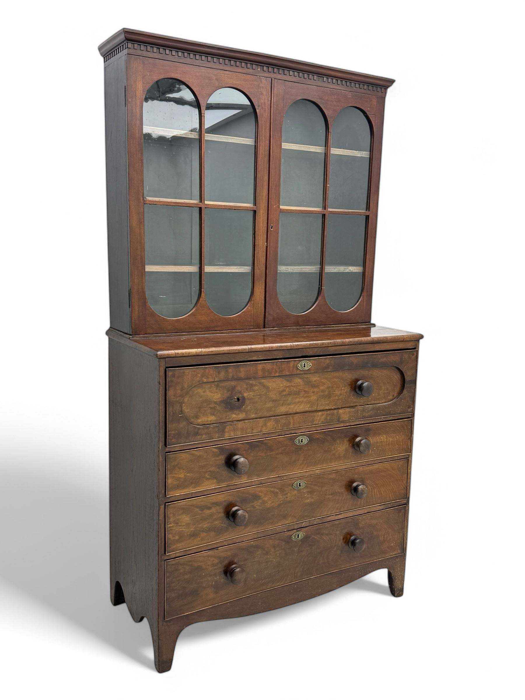 19th century mahogany secretaire bookcase, with dental cornice, two glazed doors above three long graduating drawers