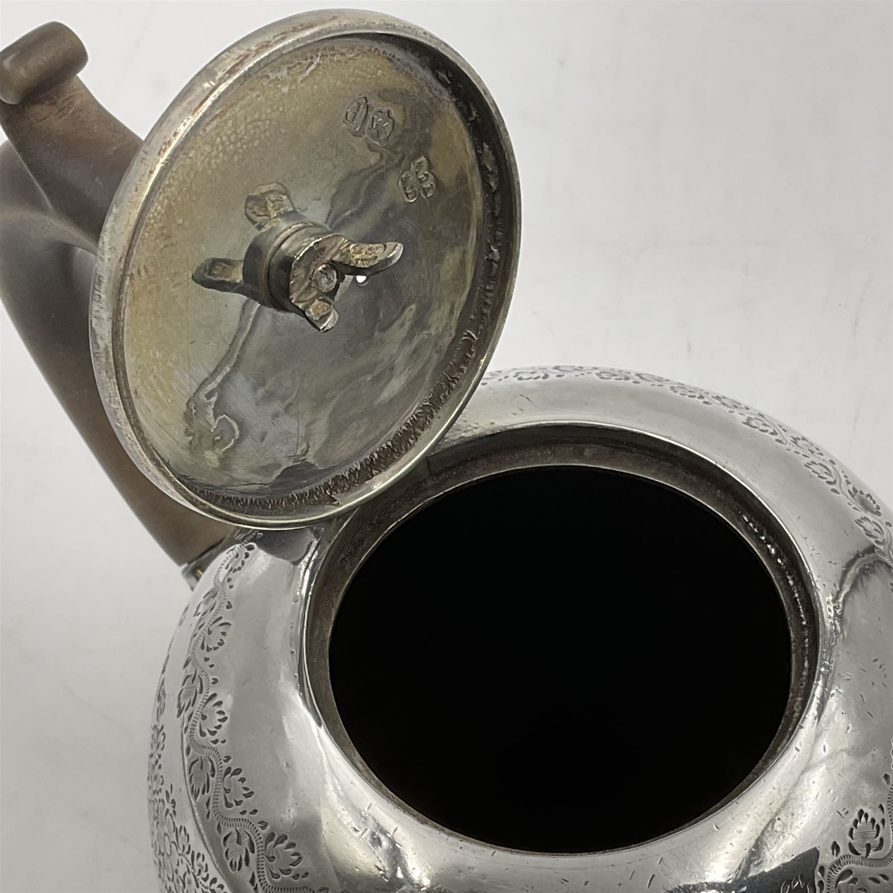 Late Victorian silver bachelors three piece tea service, comprising bullet shaped teapot, open sucrier and milk jug, each engraved with monogram surrounded by birds upon and amidst a blossoming vine, the teapot with scroll capped curved wooden handle and wooden finial to cover, hallmarked Wakely & Wheeler, London 1890, teapot including handle H12cm, sucrier H5.5cm 