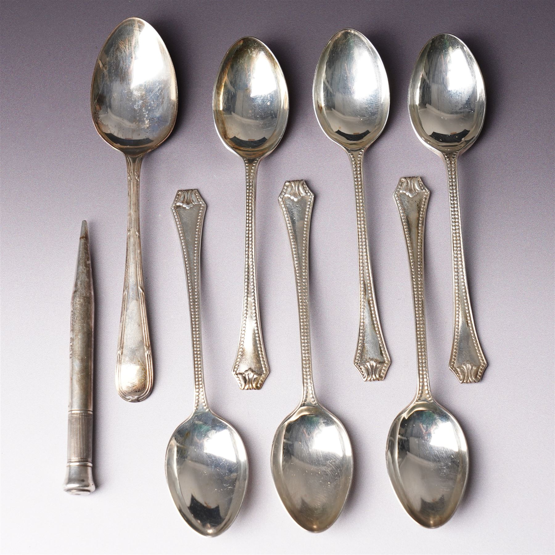 Set of six bead edge silver teaspoons Birmingham 1929-1933,  single teaspoon and a Mordan Everpoint silver pencil