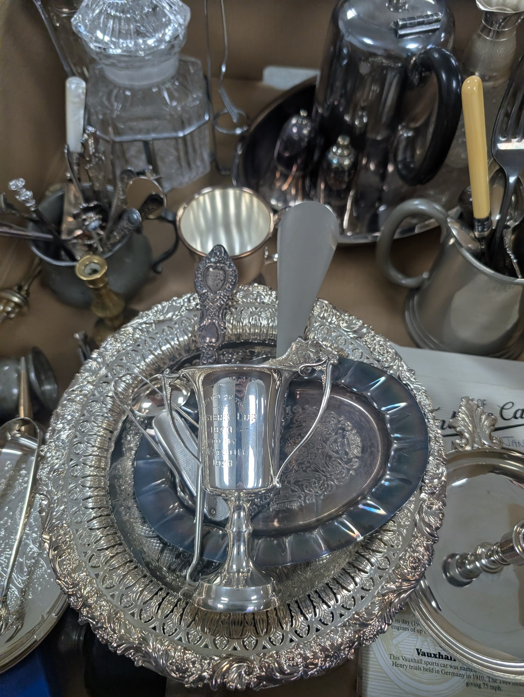 Small collection of silver comprising trophy, fruit knife, spoon, sugar tongs and silver handled hook and shoe horn, together with a silverplated epergne and other metalware