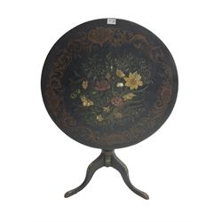 19th century black lacquered pedestal table, circular tilt-top with mother of pearl inlay amongst flower head and floral painted decoration and a scrolling foliate border, raised on ring turned column with cabriole tripod base 
