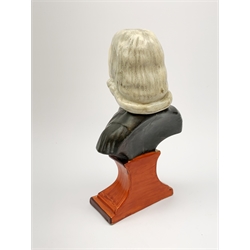 A Staffordshire bust, modelled as John Wesley, upon spreading base, H24.4cm.  