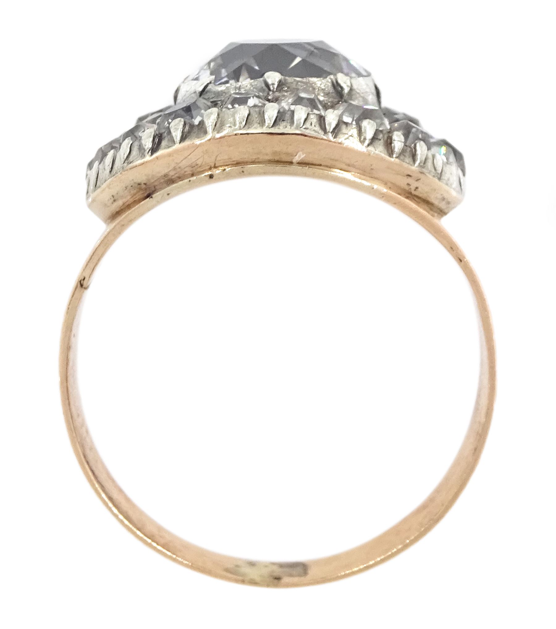George III gold and silver old cut diamond cluster ring, the principal diamond of approx 0.75 carat, with pave set old cut diamond surround
