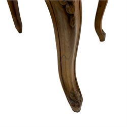 19th century French walnut dressing stool, rectangular seat upholstered in a floral needlework tapestry top, shaped apron with applied carved flower heads, on cabriole supports with acanthus carved feet