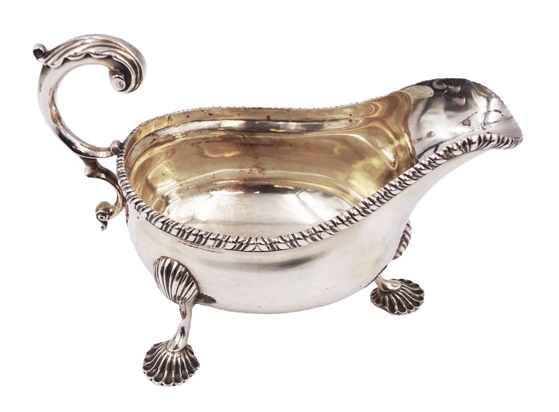 Victorian silver sauce boat, of typical form with oblique gadrooned rim and acanthus capped flying C scroll handle, upon three shell pad feet, hallmarked Charles Stuart Harris, London 1898, including handle H10cm
