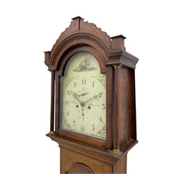 A provincial oak longcase clock retailed by “Geo Hunt, Amesbury” c1820, with a crested break arch pediment and corresponding glazed hood door flanked by two plain pillars with capitals, long trunk with a full length break arch door on a rectangular plinth with a shaped base, painted dial with Arabic numerals, minute markers, subsidiary date and seconds dials and stamped brass hands, matching painted spandrels and a depiction of sea shells to the arch, dial pinned to the movement via a Walker Hughes cast falseplate, with an eight day rack striking movement, striking the hours on a cast bell. With weights and Pendulum




