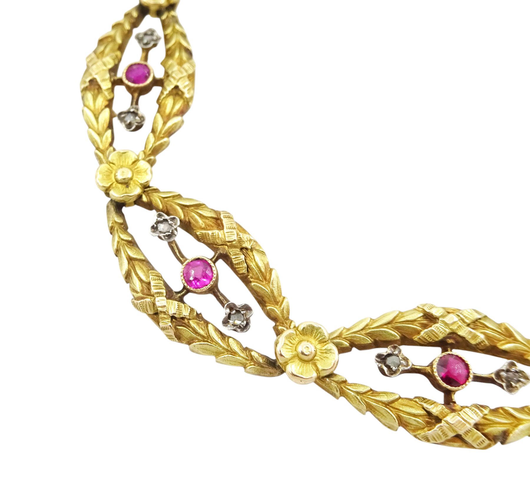 Late 19th / early 20th century French 18ct gold ruby and diamond fancy link bracelet, each laurel wreath link with a round cut ruby and two diamond chips either side and separated by a flower head, French horse's head hallmark