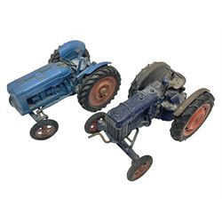 Chad Valley - two unboxed and playworn large scale Fordson tractors - No.9235 Fordson Major Tractor, dark blue diecast body, orange wheels, crank handle clockwork mechanism and 'Firestone' rubber tyres; and No.M59 New Fordson Major Tractor, blue diecast body, tinplate hinged bonnet, orange wheels and clockwork motor contained in rear wheel hub (2)