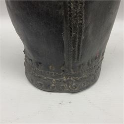 18th/19th century leather water vessel of tapering form, with three varying peaks to the flask's body to include a spout, a shorter triangular shaped peak and the tallest with wood stopper, with large stitched steams throughout, possibly Middle Eastern, H42cm incl stopper