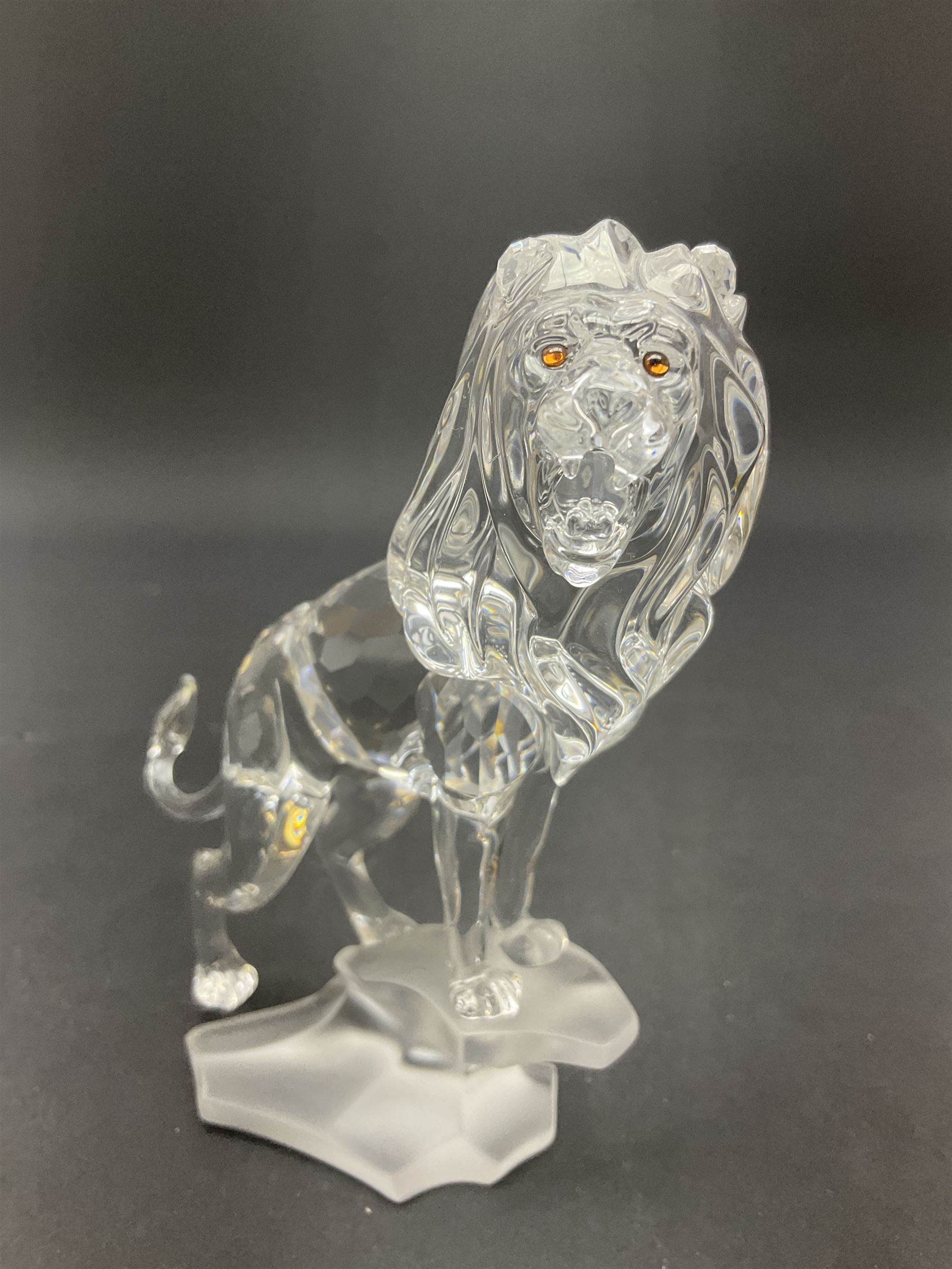 Swarovski Crystal animals, comprising camel and lion, both upon frosted crystal bases, together with Swarovski Crystal palm tree, upon similar frosted crystal base, tallest H14cm