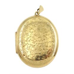 9ct gold oval locket with engraved flower decoration, Birmingham 1972, approx 12.4gm