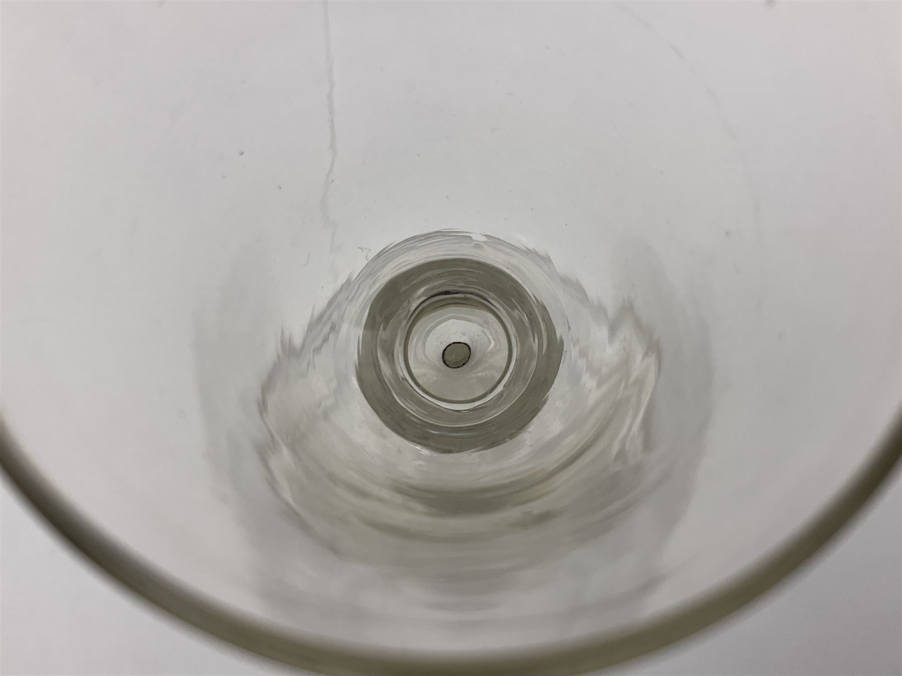 18th century wine glass, the trumpet shaped bowl upon tear drop stem and conical folded foot, H15.5cm, together with an 18th century cordial glass, the round funnel bowl on plain knopped stem and folded conical foot