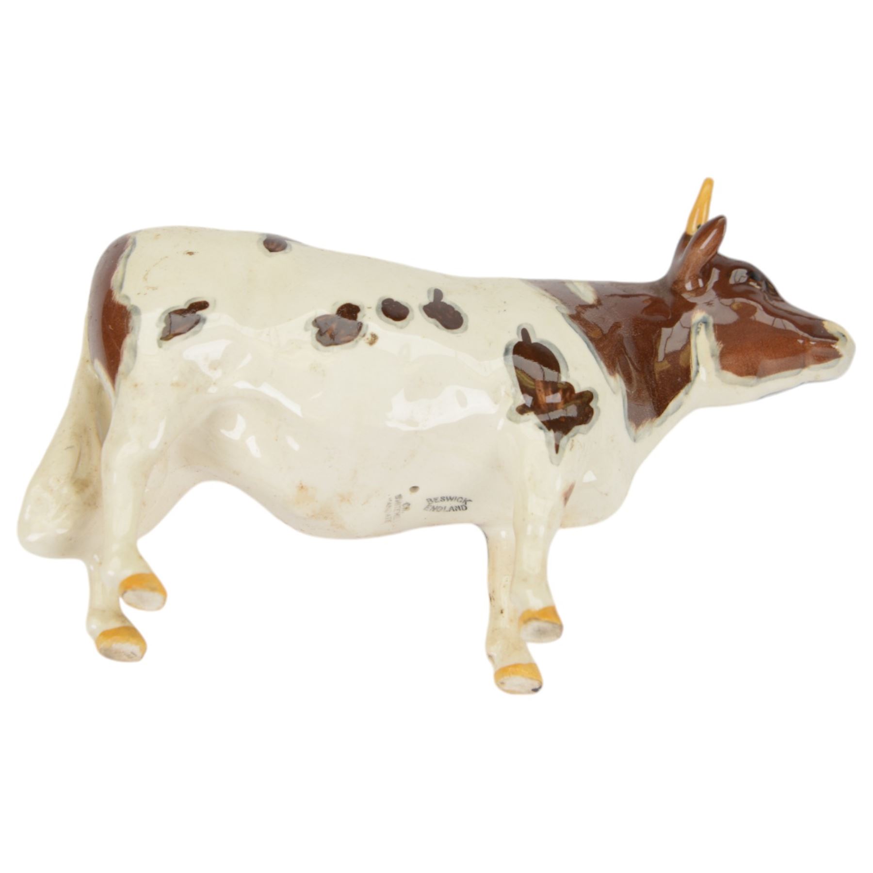 Six Beswick cattle figures, comprising Jersey family group; Bull Ch. Dunsley Coy Boy, model 1422, Cow Ch. Newton Tinkle, model 1345 and Calf, model 1249, Ayrshire family group; Bull Ch. Whitehill Mandate, model 1454, Cow Ch. Ickham Bessie, model 1350, and Calf, model 1249