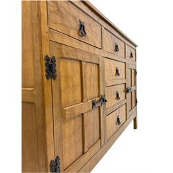 'Acornman' oak dresser, fitted with six drawers and two cupboards, carved Acorn signature