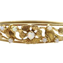 9ct gold opal, floral openwork design hinged bangle, London 1972