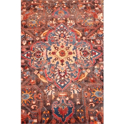  Persian style red ground rug, central medallion, repeating border, 268cm x 163cm  