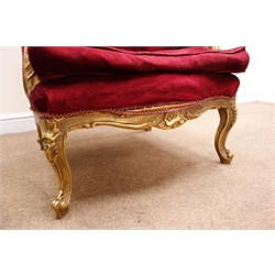  French upholstered wing back chair, the gilt frame with scroll carved cresting and acanthus arms, serpentine frieze on cabriole legs, loose seat cushion, W76cm, D68cm, H123cm  