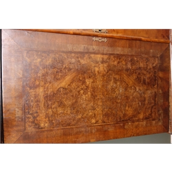  18th century and later cross banded burr walnut cupboard on chest, projecting cornice, two panelled cupboard doors enclosing seven graduating drawers, above three base drawers, on bun feet, W112cm, H175cm, D60cm  