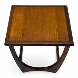 G-Plan - 'Astro' mid-century nest of three teak occasional tables, each with a square top with outer banding, on U-shaped end supports united by a stretcher