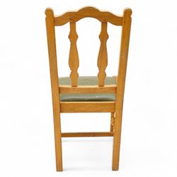 Beaverman - set of four oak dining chairs, shaped cresting rail over two shaped vertical rails, green leather upholstered drop-in seats, on octagonal supports united by plain stretchers, each carved with beaver signature, by Colin Almack, Sutton-under-Whitestone Cliffe, Thirsk