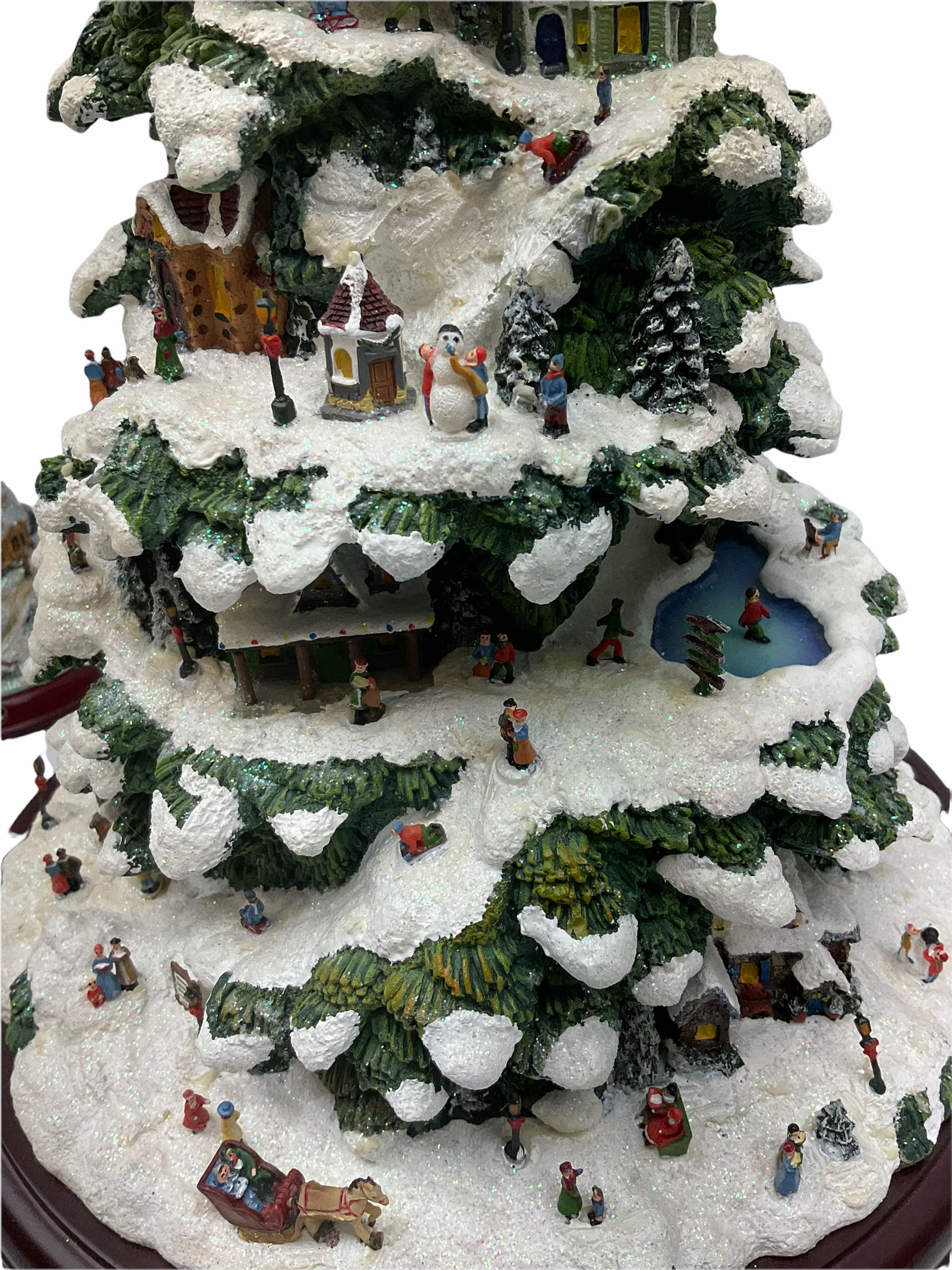 A collection of illuminating Christmas decorations, including Hawthorne Village decorations by Thomas Kinkade, Candle holders Winter Wonderland, a wreath candleholders Holiday Gathering, Village Christmas illuminated tree sculpture H39cm and Santa's on his Way, along with A Very Beary Christmas illuminated tree 33cm, and three other illuminating Christmas decorations, all with plugs. 