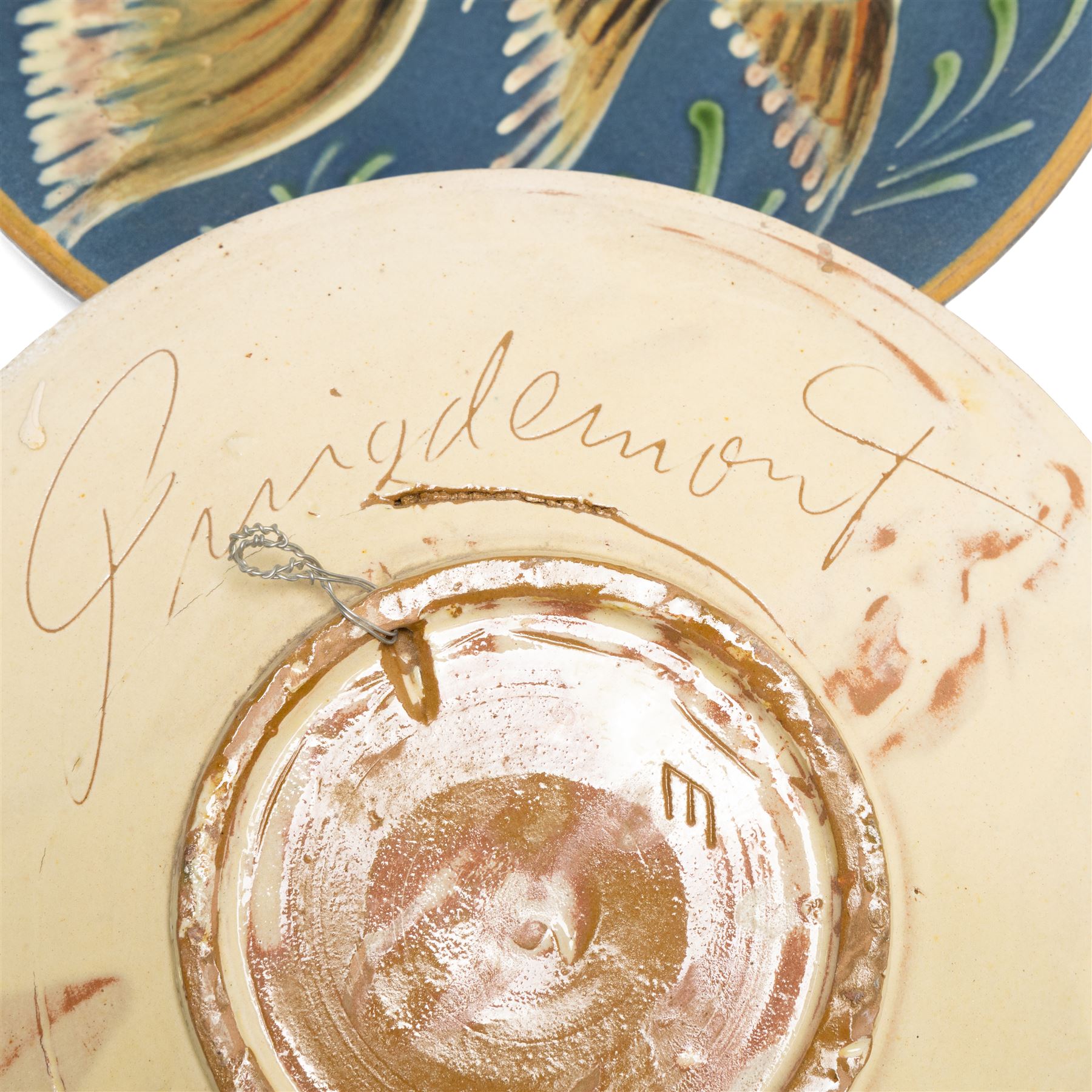 Puigdemont studio pottery slipware chargers, each uniquely decorated with stylised fish, largest D28cm 