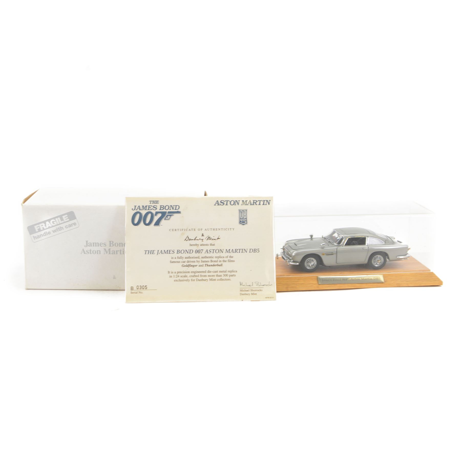 Danbury Mint James Bond 007 1:24 scale Aston Martin DB5, authentic replica of the car driven in Goldfinger and Thunderball, with certificate of authenticity, display case and original box