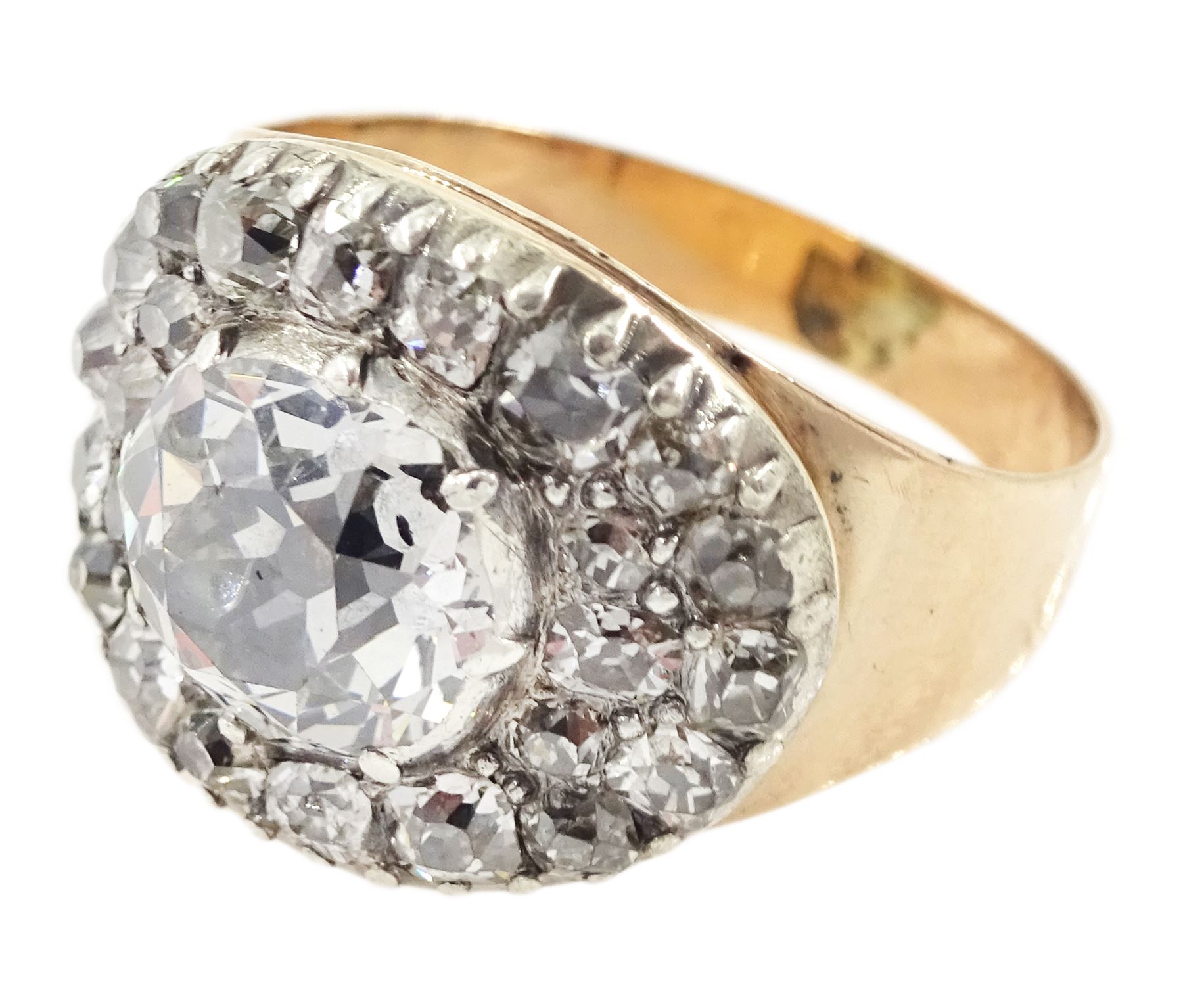 George III gold and silver old cut diamond cluster ring, the principal diamond of approx 0.75 carat, with pave set old cut diamond surround

