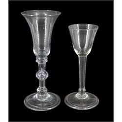 18th century drinking glass, the bell shaped bowl upon a triple knopped stem and folded conical foot, H18cm, together with a further 18th century drinking glass, the funnel bowl upon a basal knopped stem and folded conical foot, H15.5cm