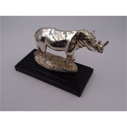 Filled silver model of a rhinoceros by Afrisilver, upon lacquered wooden base, H11.5cm