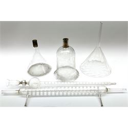 Collection of 19th century and later pharmaceutical laboratory glass, to include, large filter funnel, graham condenser, conical flask, bell jar and another with graduated tube, Provenance: discovered in the storeroom of a long established Hull pharmacist and opticians