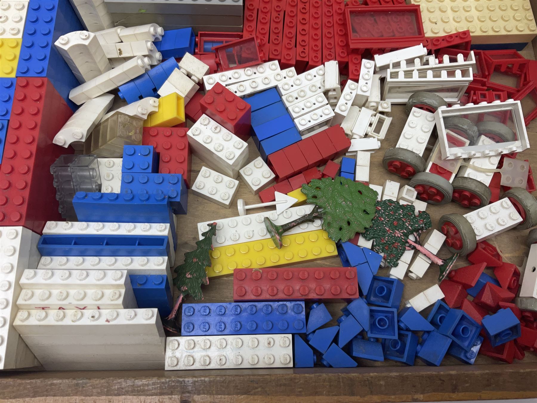 Lego - quantity of loose sections including various size blocks, base plates, windows, axles with wheels, alphabet/number blocks etc; in wooden box