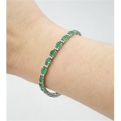 18ct white gold oval emerald and round brilliant cut diamond bracelet, stamped