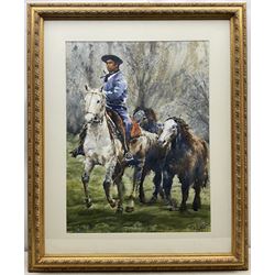 Diego Ferrer (Argentinian Contemporary):  Gaucho and Three Horses, watercolour signed and dated '24, 67cm x 50cm