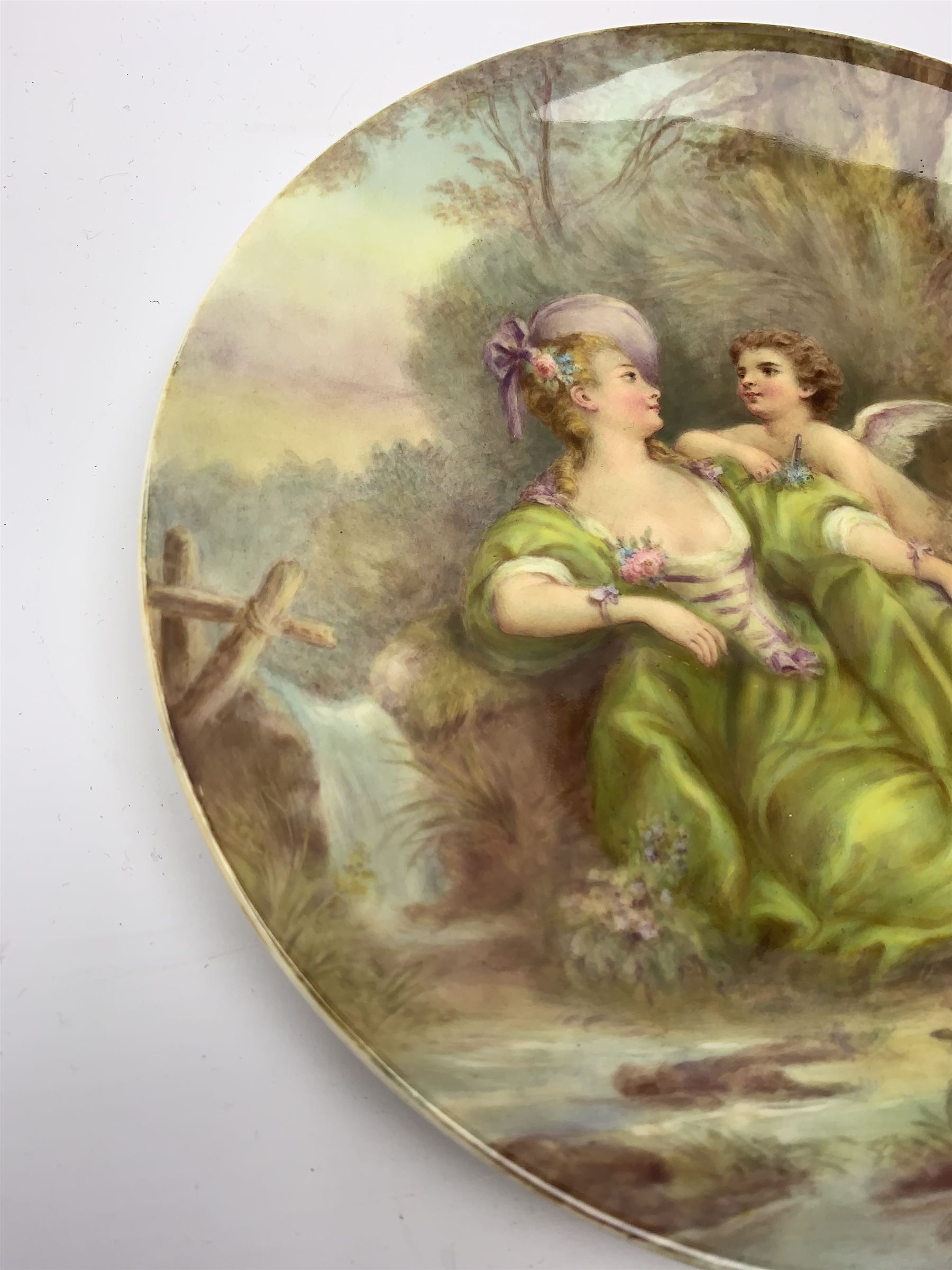 Late 19th century porcelain plate, hand painted by Frederick Sutton, depicting a female figure and putto within a wooded landscape, with recumbent sheep and brook to the fore, signed F N Sutton, unmarked verso, D22.5cm

Frederick Sutton was employed as a painter at the notable factories of Royal Worcester, Coalport, and Minton. 