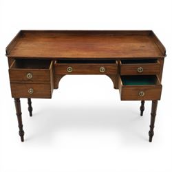 Late Georgian mahogany sideboard, circa 1820, the rectangular top with gallery, above an arrangement of four drawers with brass ring handles, one double height drawer to the left, a central single frieze drawer, and two drawers to the right, upon turned legs