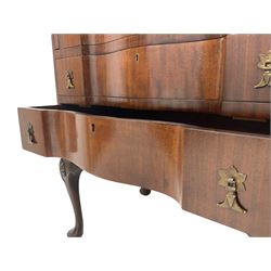 Early 20th century mahogany serpentine bureau, fall front above three drawers