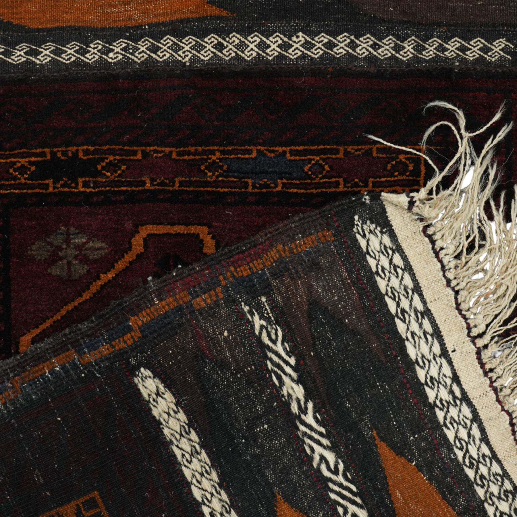 Group of four late 20th century wool kilim rugs, comprising a narrow tribal runner with stylised tree motifs and hooked guard bands (H 180cm, W 56cm), a lozenge medallion rug with decorative striped ends (H 125cm, W 75cm), a red and blue kilim with trefoil repeat field and multicoloured border bands (H 187cm, W 98cm), and a wide horizontal striped example with alternating lozenge and linear motif rows (H 260cm, W 173cm)